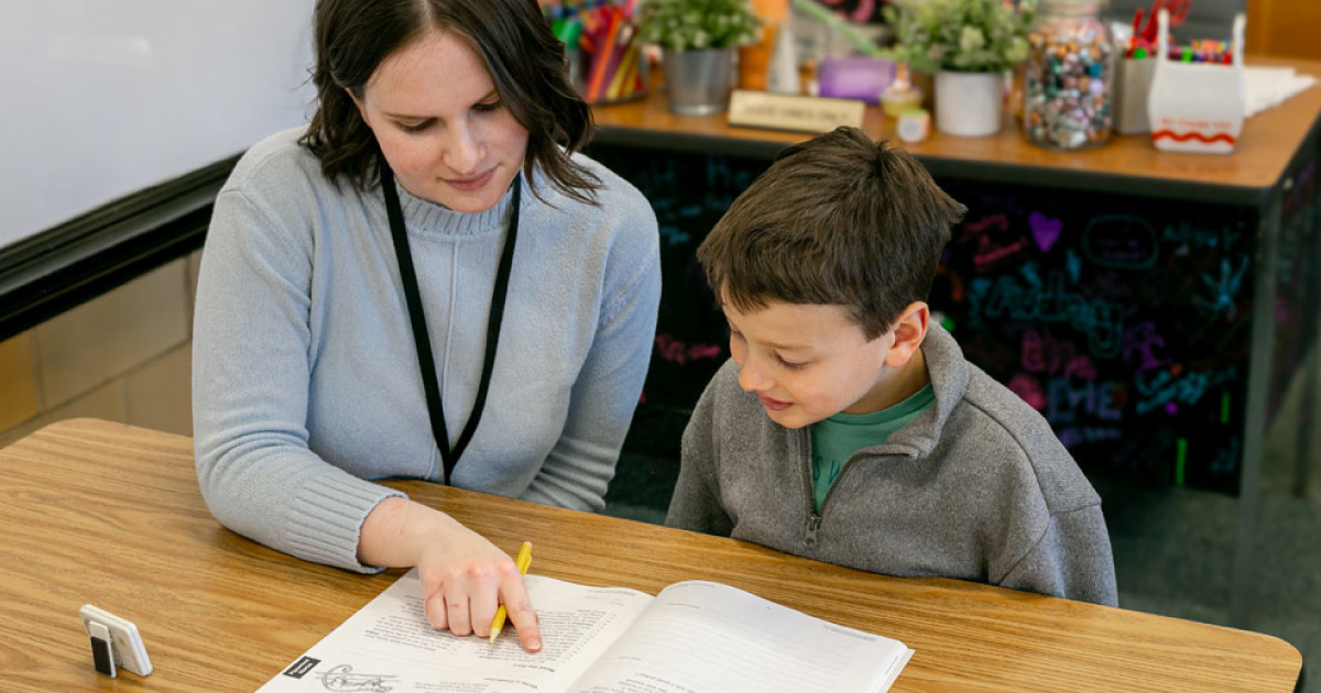 Student working in Read Naturally Encore II with a teacher