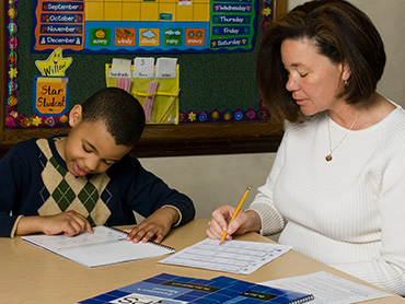 Teacher with student